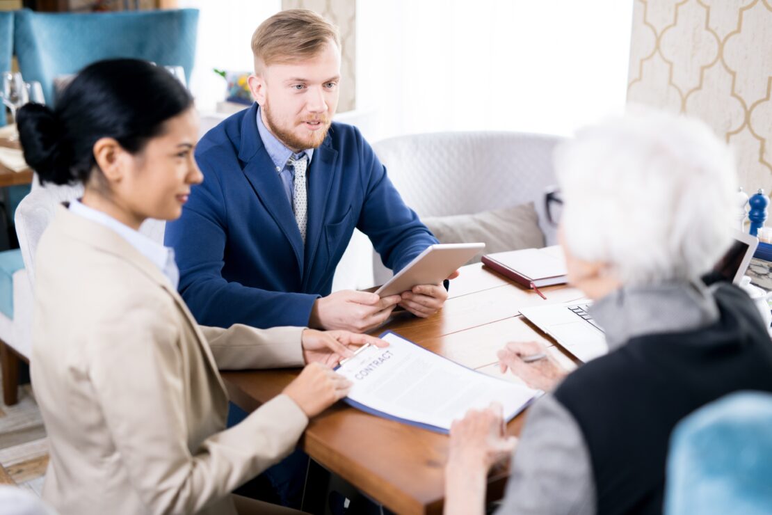 Business meeting contract signing elderly woman